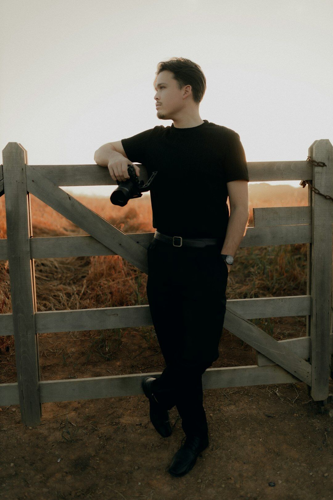 Photographer walking through the Danish countryside with a camera
