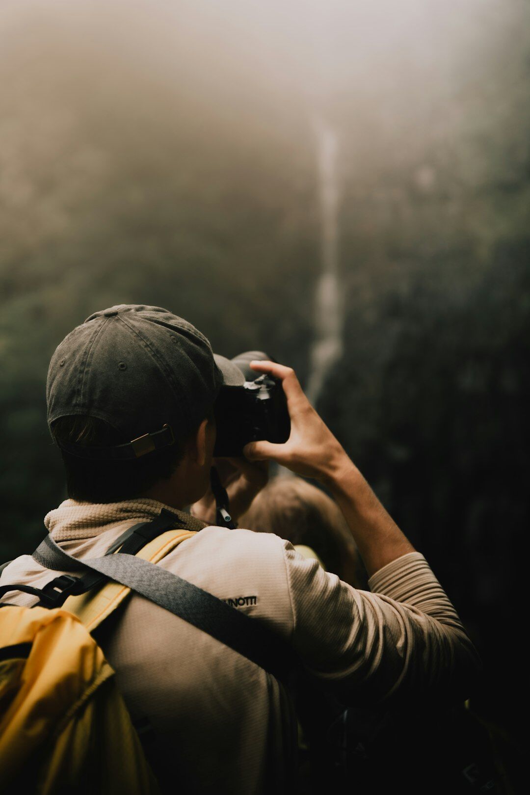 Documentary photographer holding a camera in a Danish coastal town